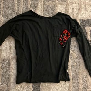 Long sleeved dark grey shirt.